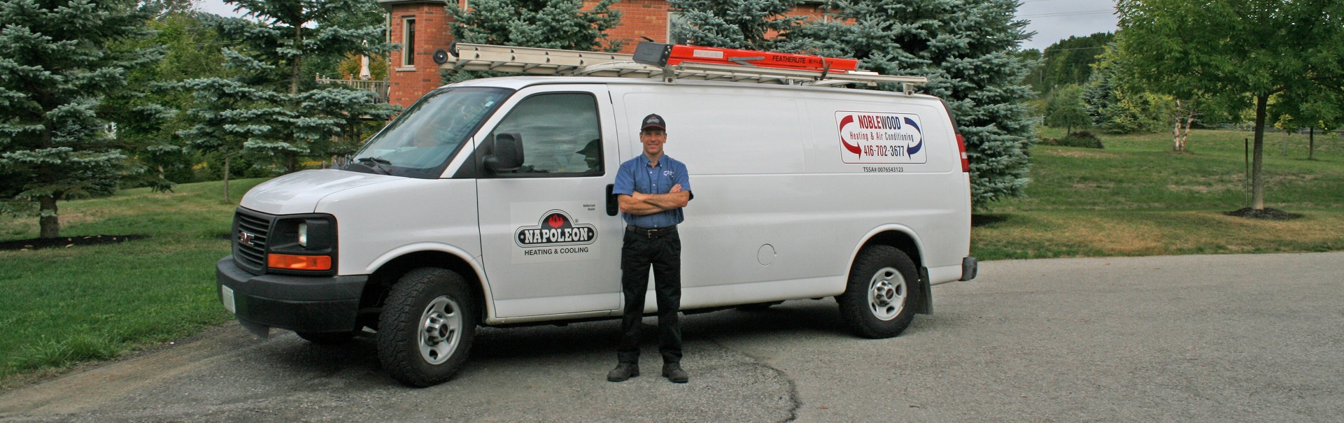 Alan standing beside Noblewood vehicle