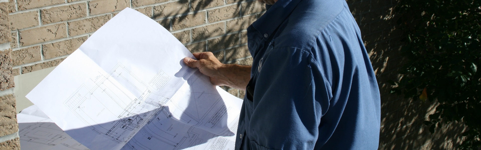 Man holding blueprint